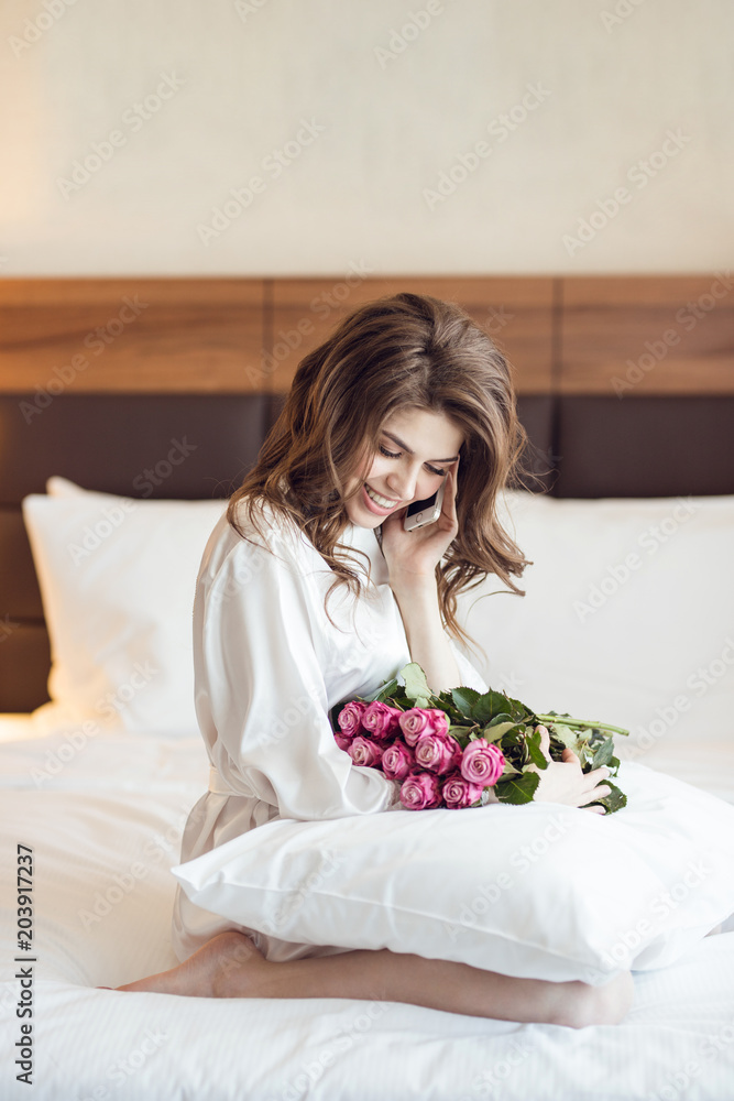 Beautiful woman with a bouquet of flowers