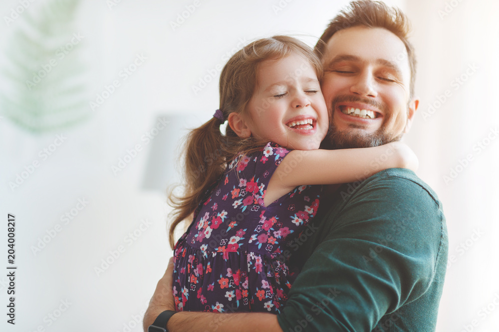 Fathers day. Happy family daughter hugs his dad