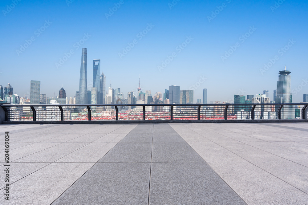 empty marble floor with panoramic city skyline