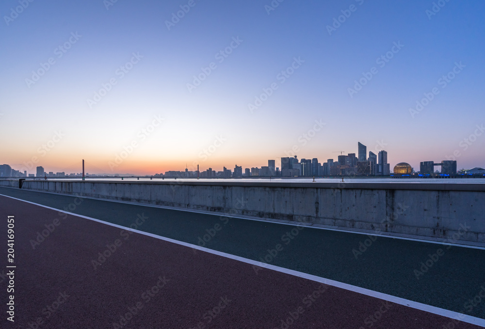 empty road with city skyline