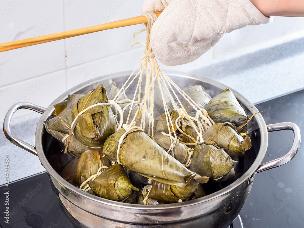 Procedure step of making zongzi or rice dumpling recipe, steam and boil on Dragon Boat Festival, Asi