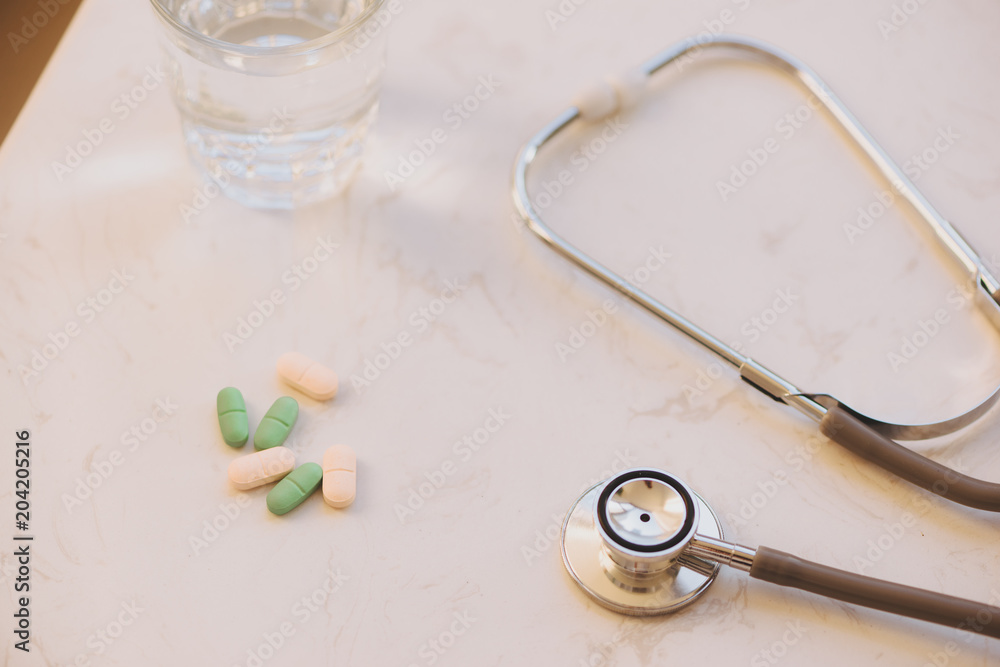 Pharmacy background on a white table. Tablets on a white background. Pills. Medicine and healthy. Cl