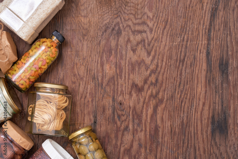 Food donations on wooden background, top view