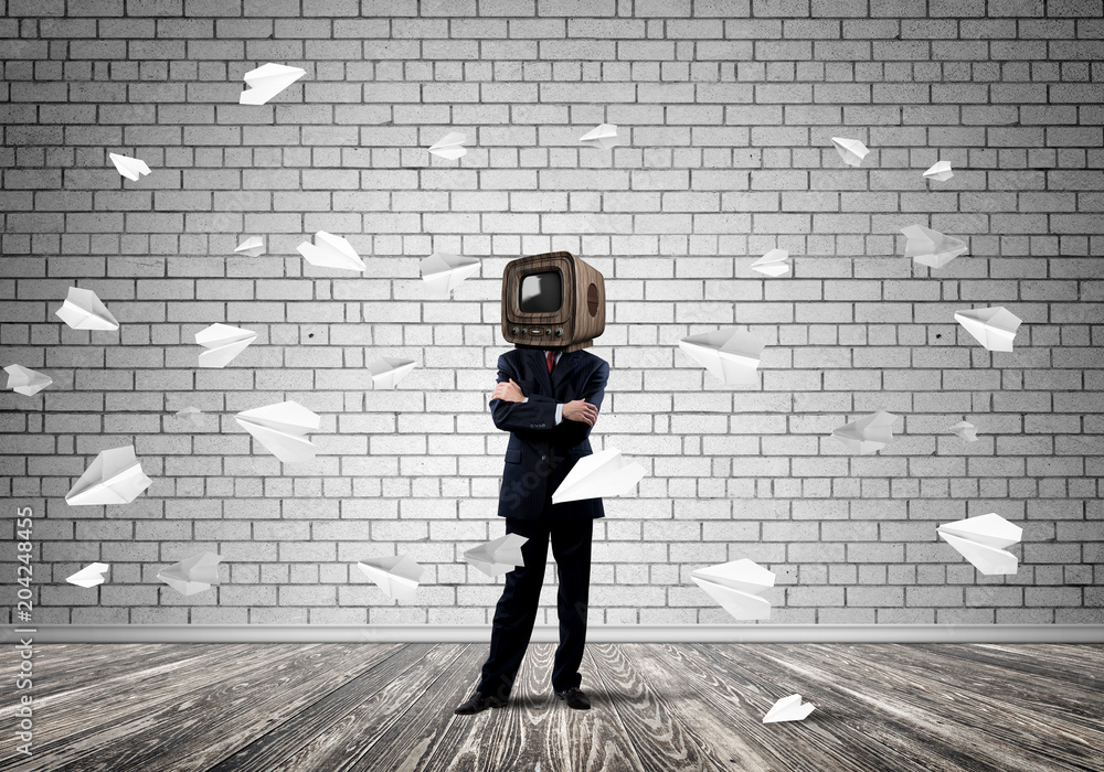 Businessman with old TV instead of head.