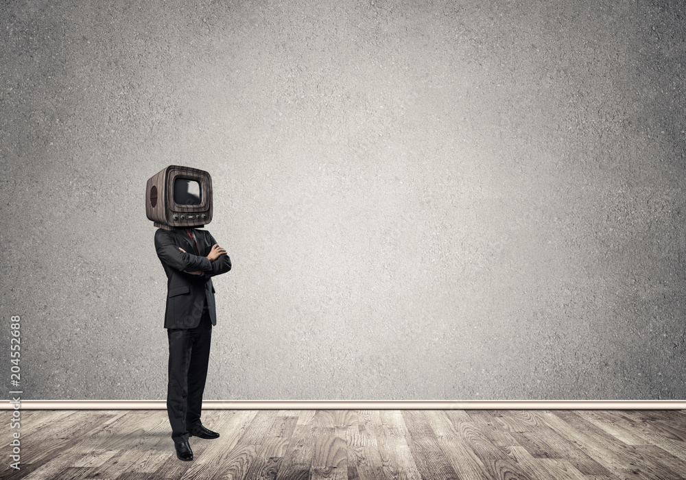 Businessman with an old TV instead of head.