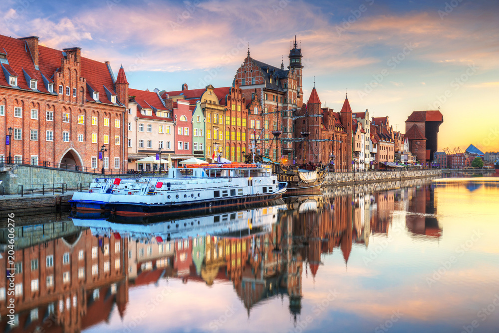 Beautiful old town of Gdansk reflected in Motlawa river at sunrise, Poland.