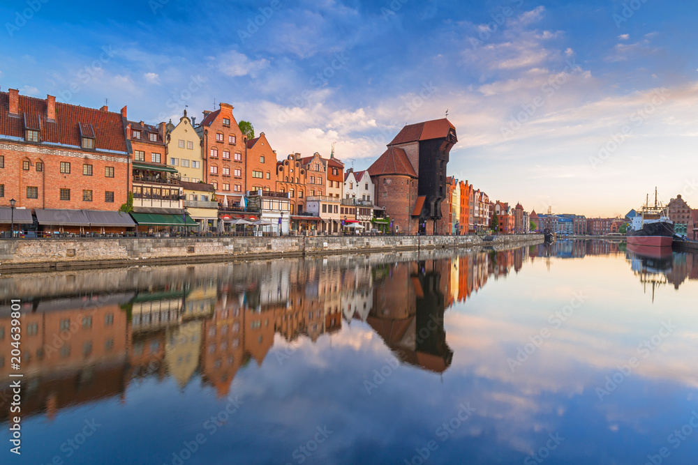 Beautiful old town of Gdansk reflected in Motlawa river at sunrise, Poland.