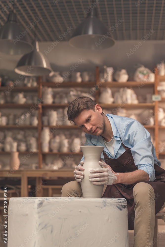 Young master working on a potters wheel