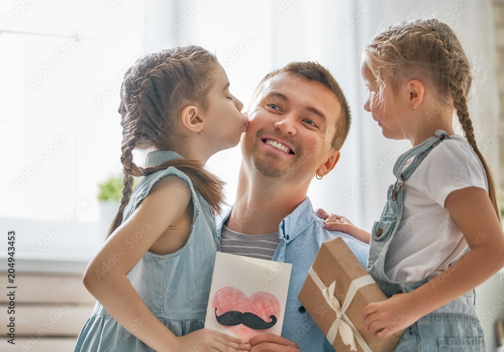 daughters congratulating dad