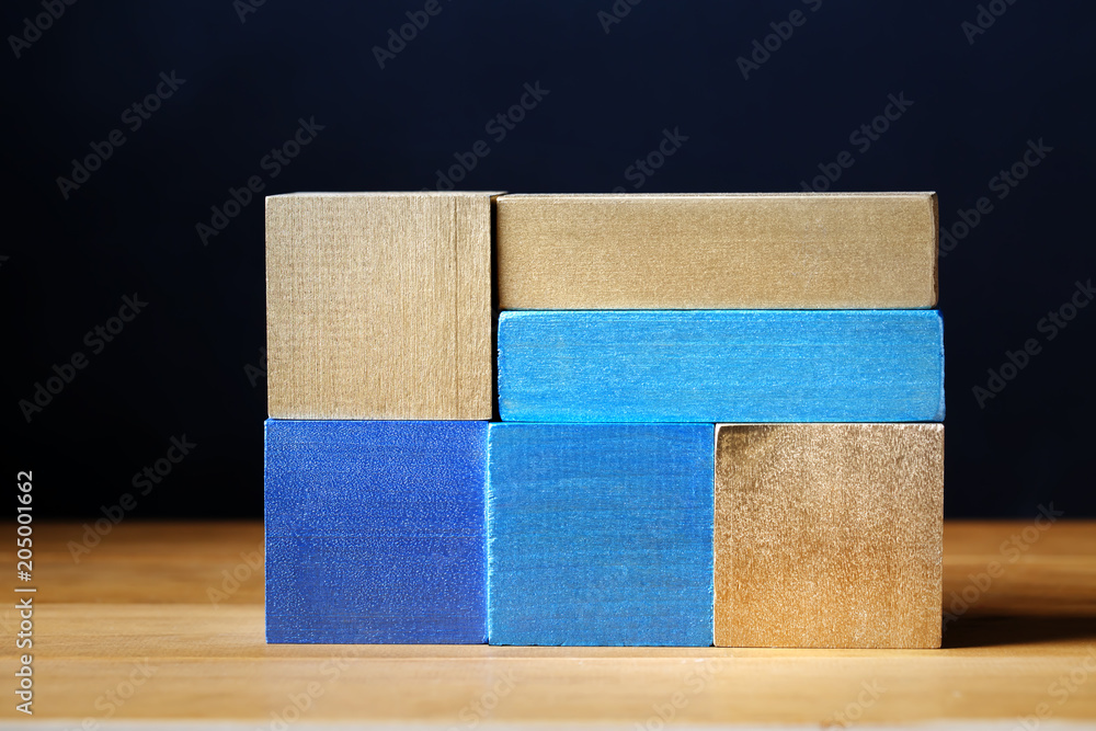 Toy blue wooden blocks abstract stack background