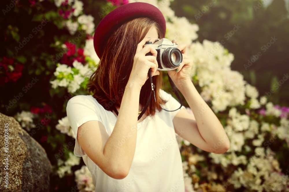 Beautiful woman with a vintage camera