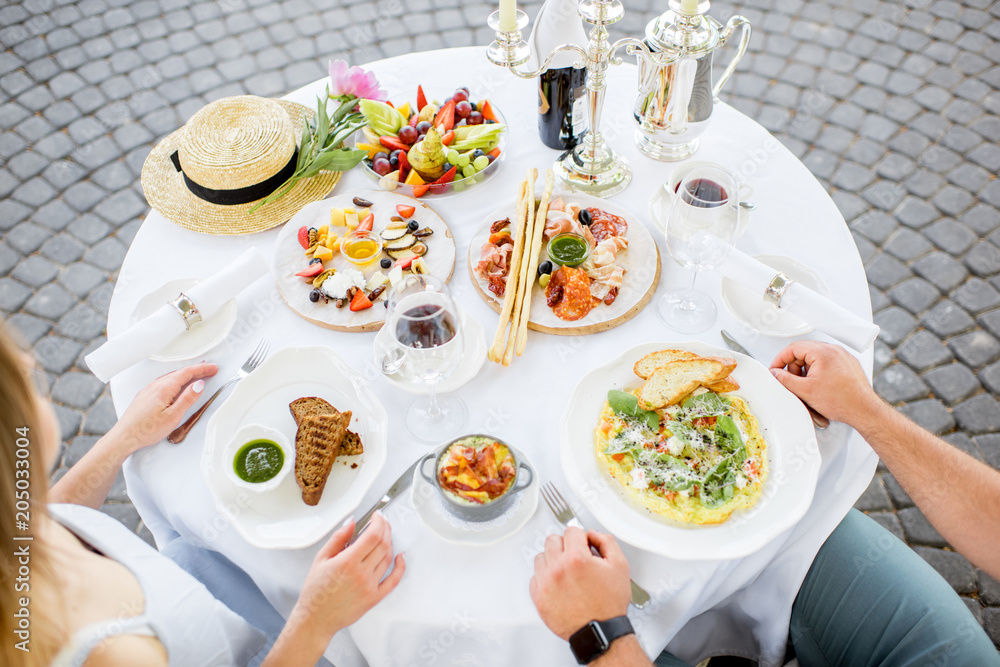 Table with romantic breakfast outdoors