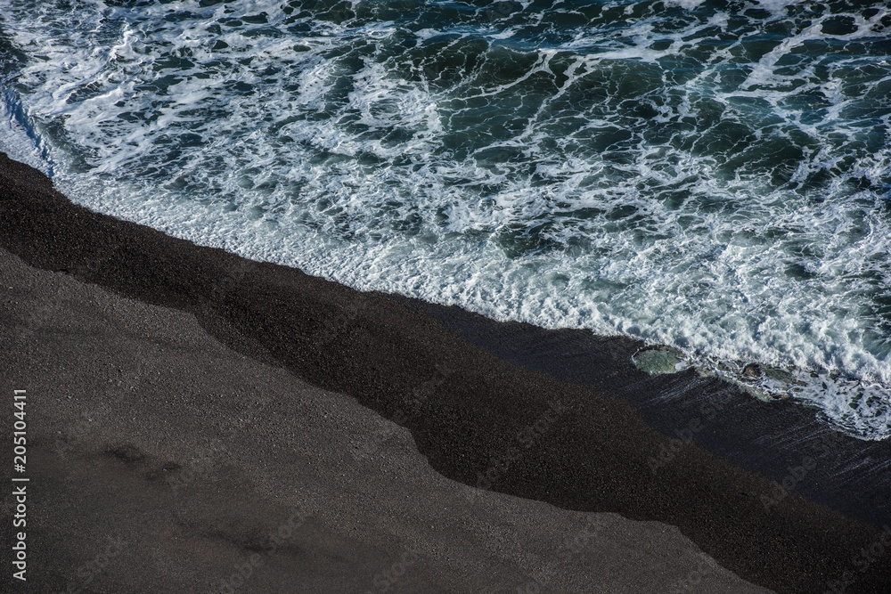 The black sand beach in Iceland. Sea aerial view and top view. Amazing nature, beautiful backgrounds