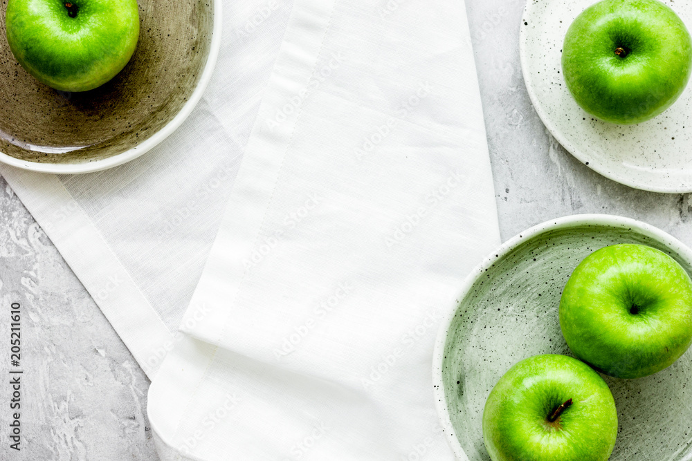 Healthy green food with apples on plates stone background top vi