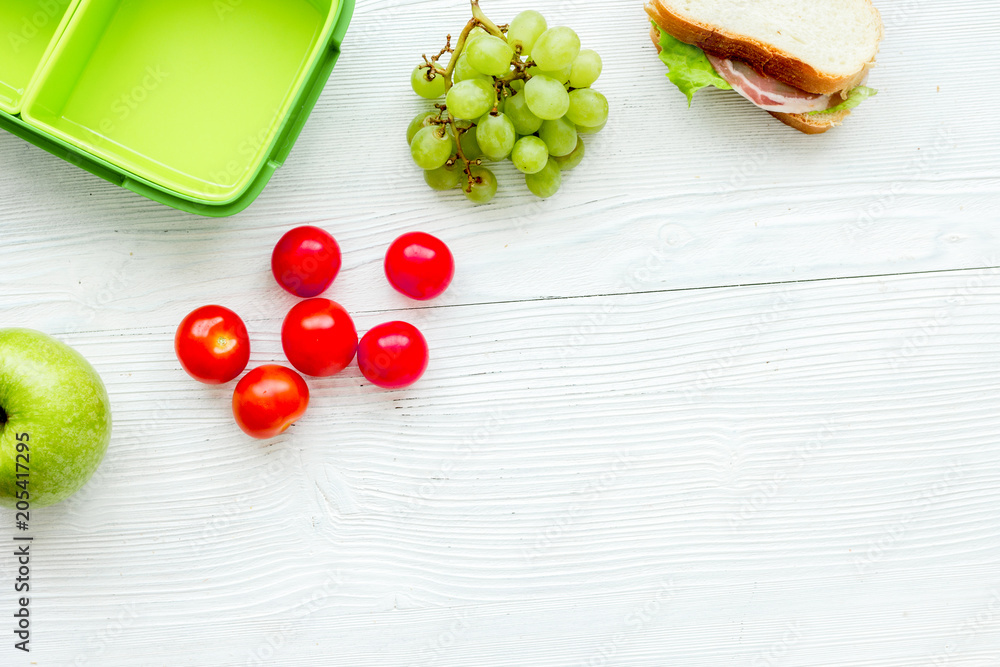 healthy food in lunchbox for dinner at school white table backgr