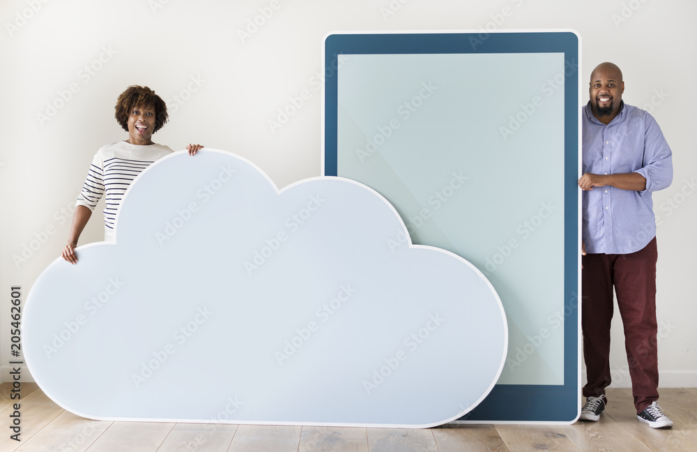 Diverse couple holding a tablet