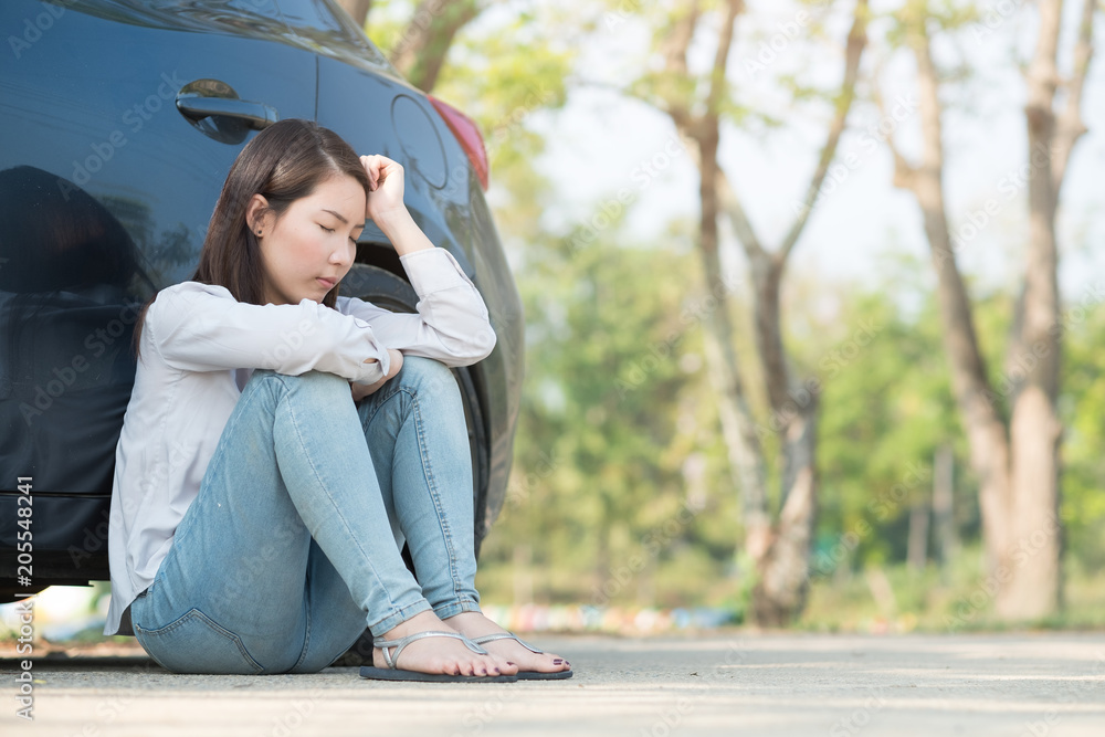 Young woman feel sad because of her car broken down