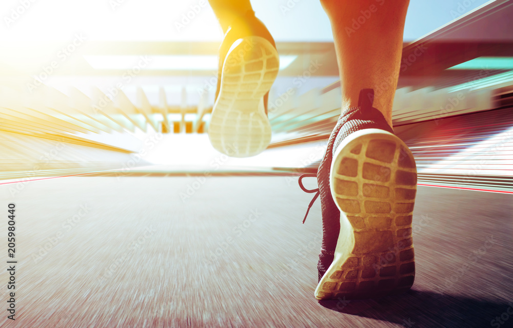 Close up of runner legs run on the stadium .