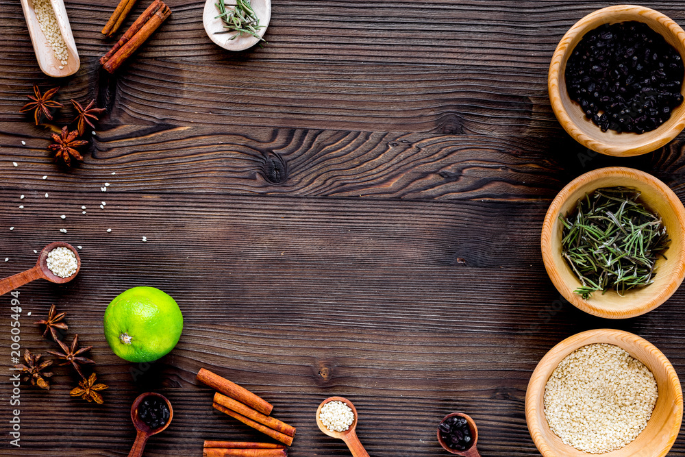 Cooking with vanilla, cinnamon, salt and pepper on kitchen table