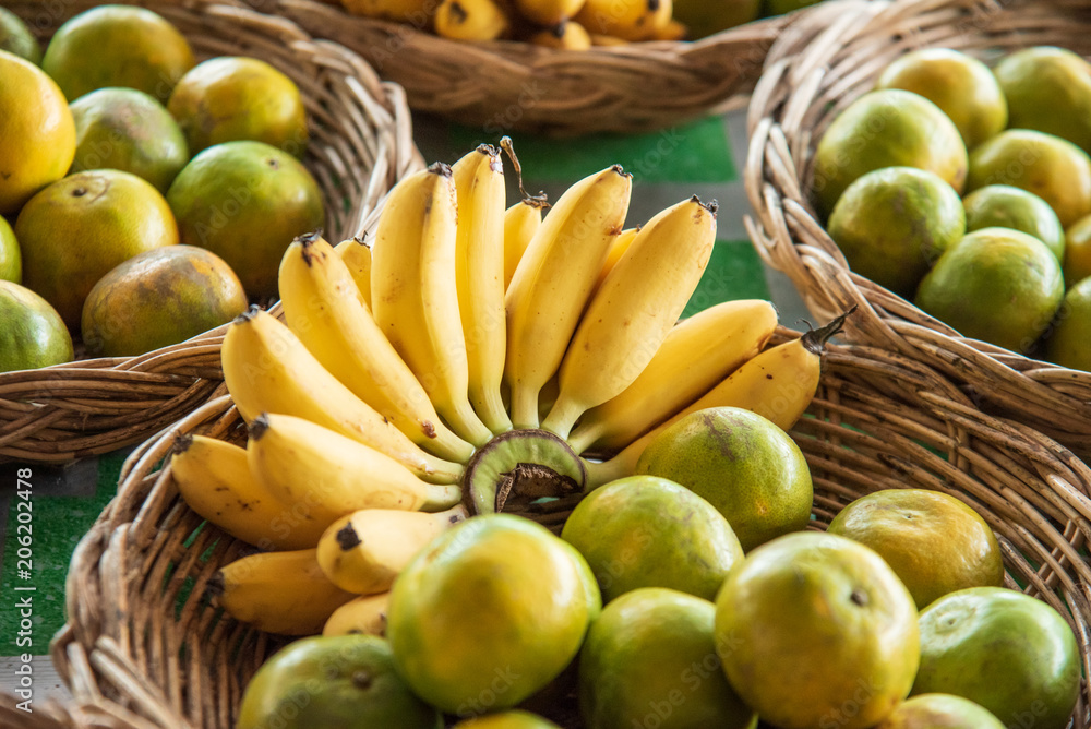 banana and orange in a fruit stand in thailand