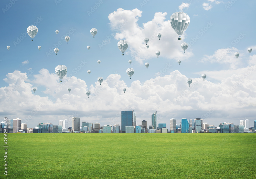 Concept of eco green life with aerostats flying above city