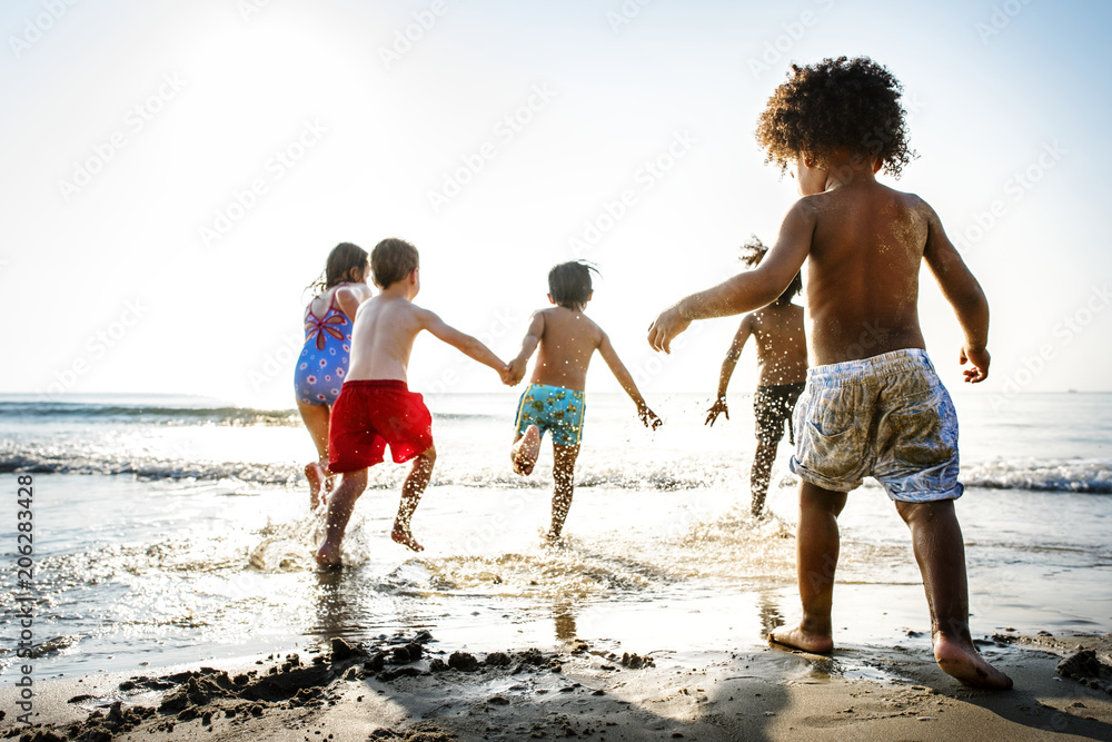 Children having fun on the beach