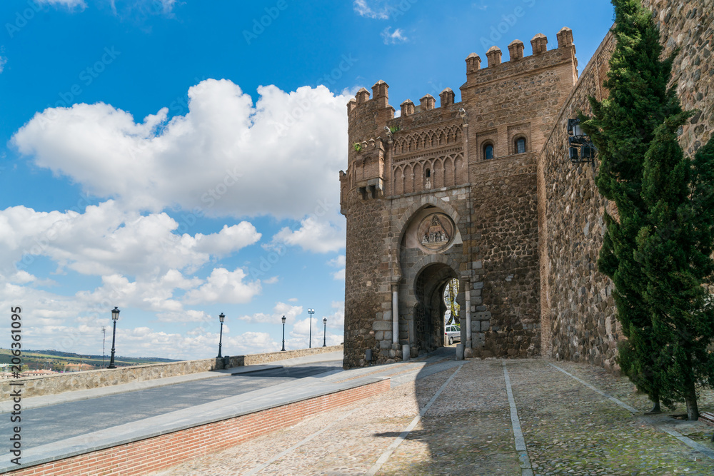 Puerta de Valmardón in the historic city of Toledo with nice sky in Toledo near Madrid, Spain.