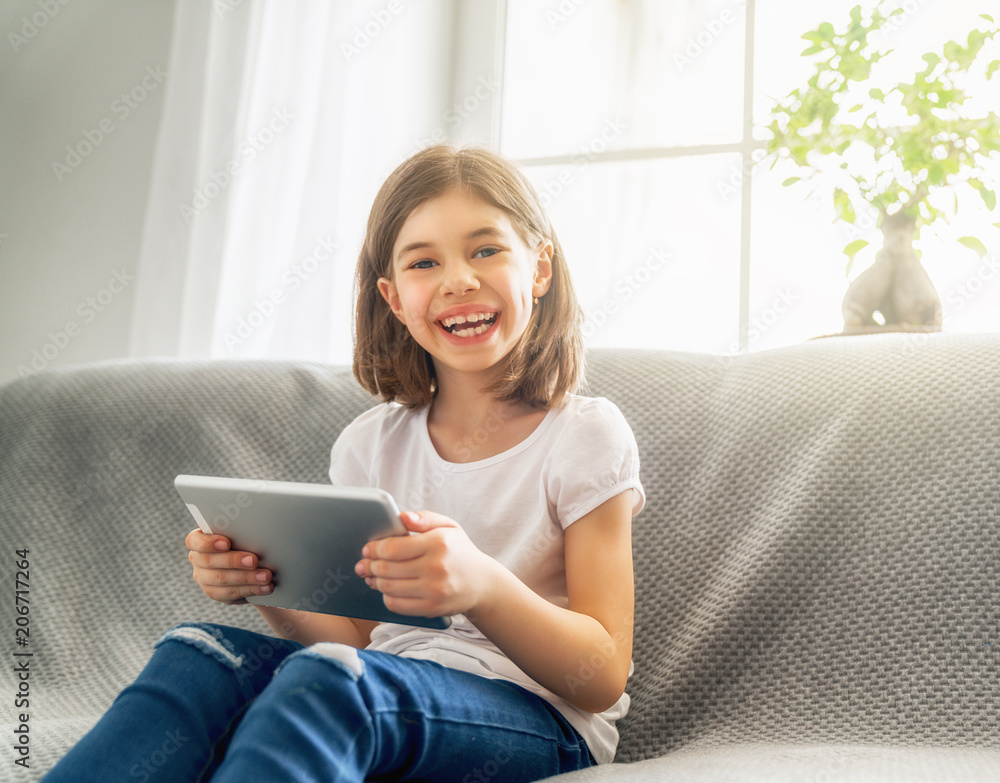 girl playing with tablet