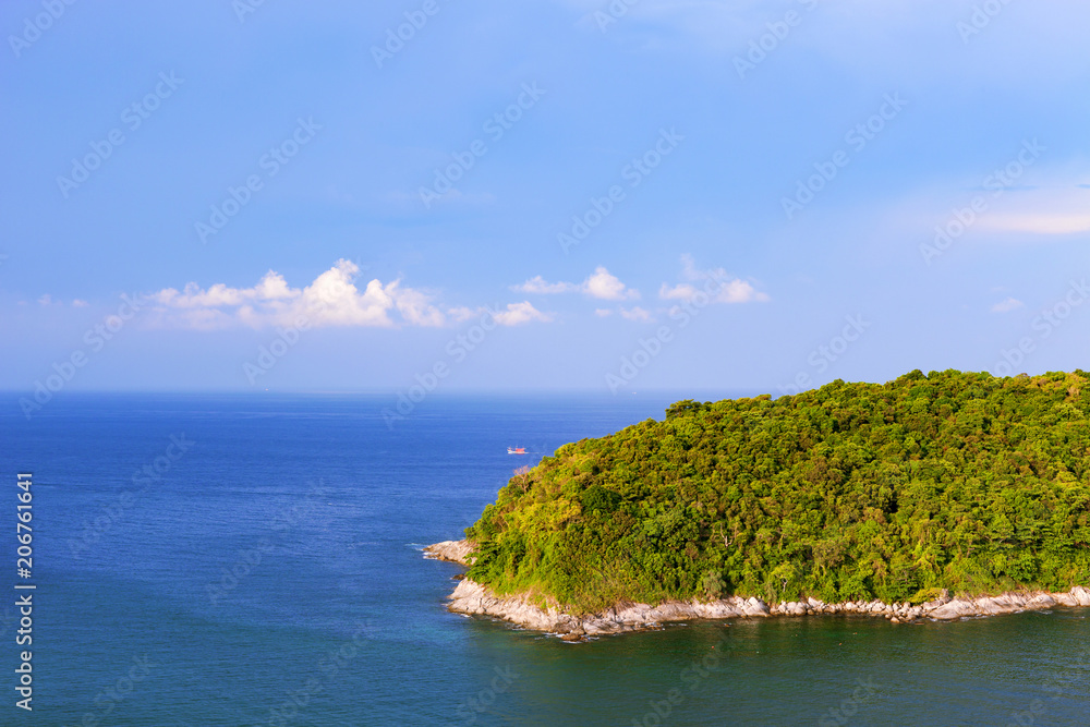 small tropical island with clear blue sky and clouds scenery view in phuket thailand