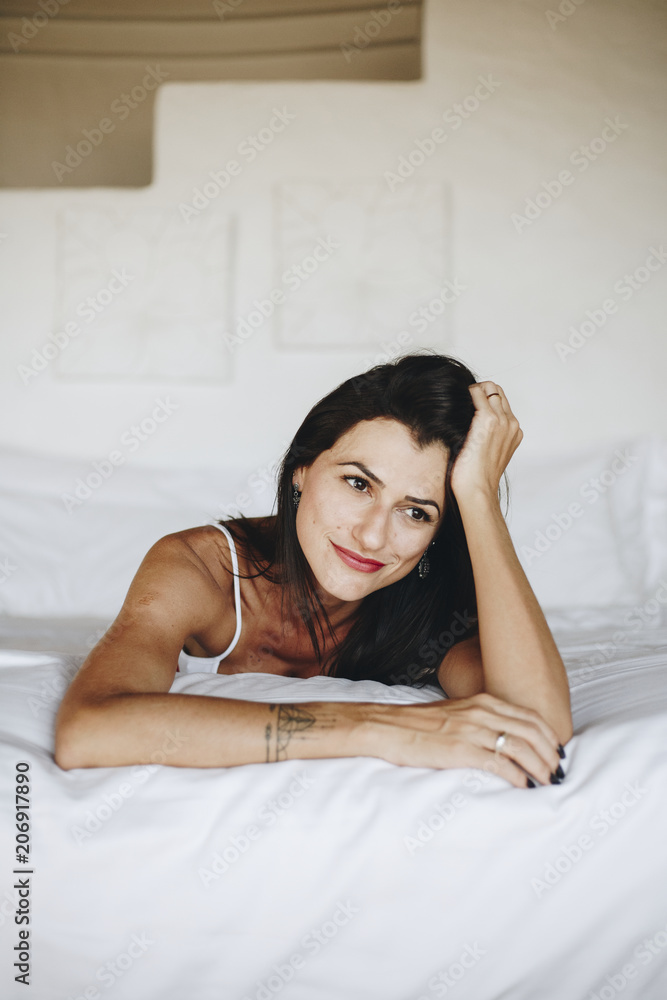 Beautiful woman relaxing in bed