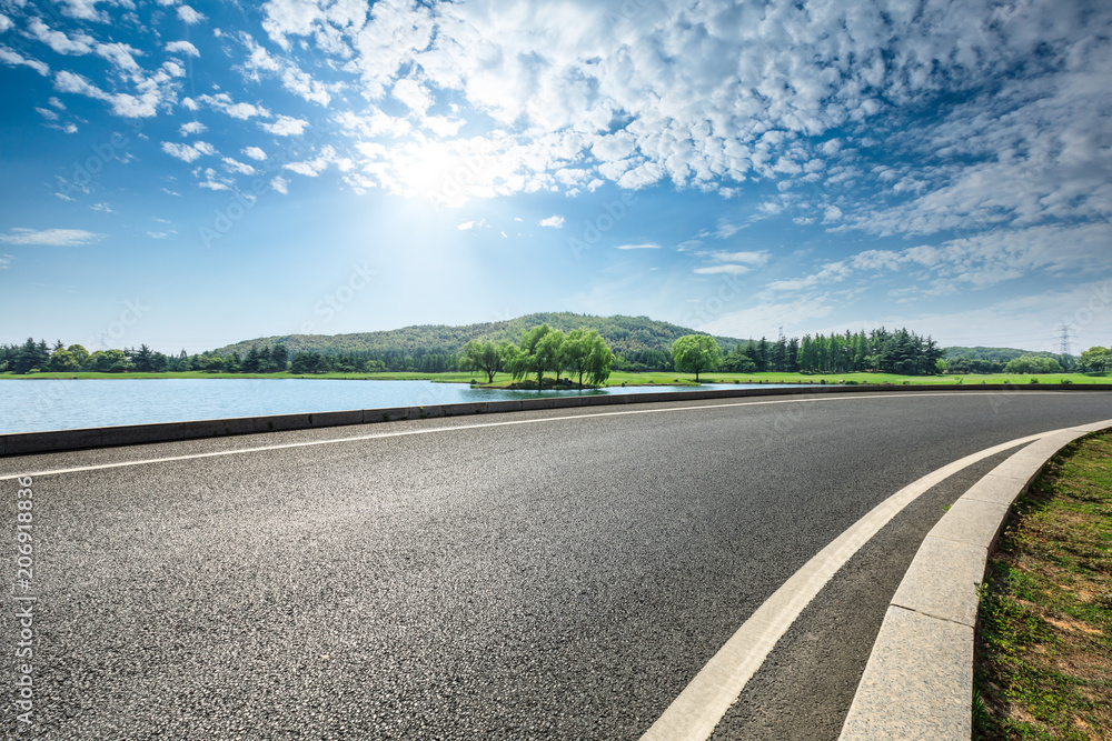 Empty asphalt road and mountains with sky clouds landscape