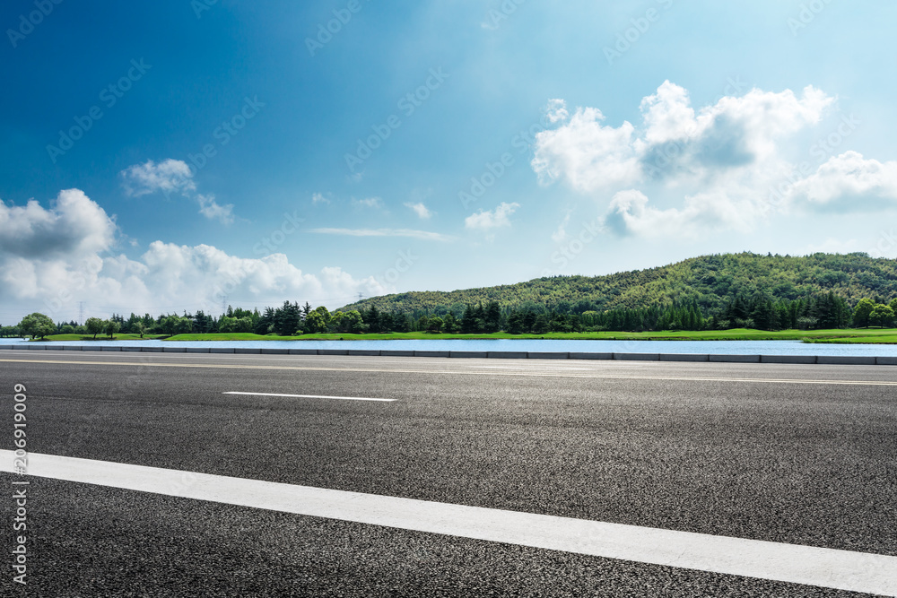 Empty asphalt road and mountains with sky clouds landscape