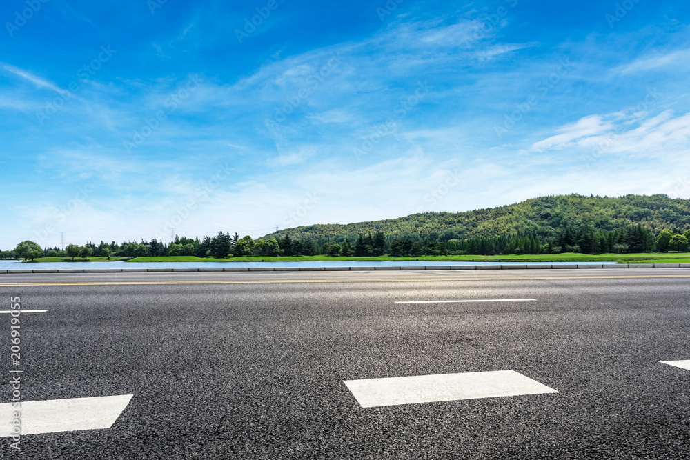 Empty asphalt road and mountains with sky clouds landscape