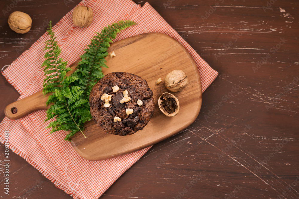 Dellicious homemade chocolate walnut muffin on table. Ready to eat.