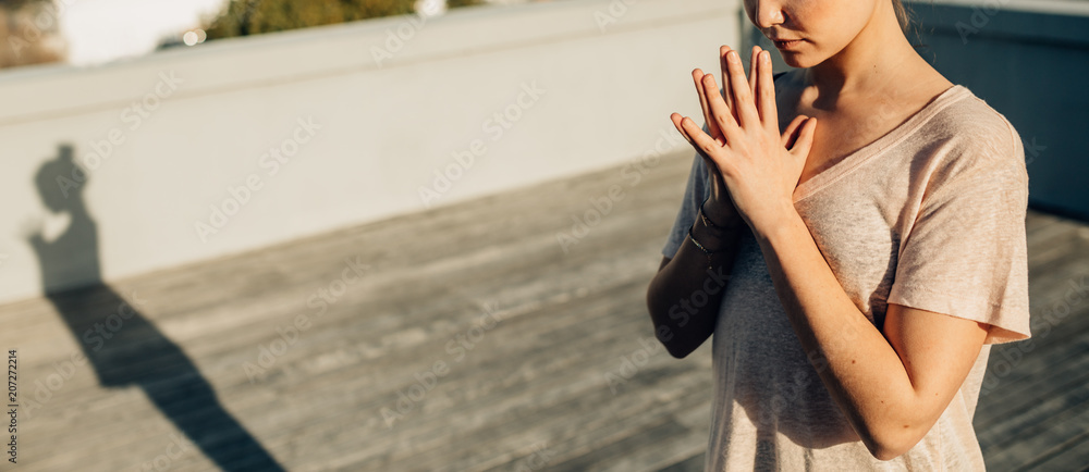 Woman doing yoga outdoors