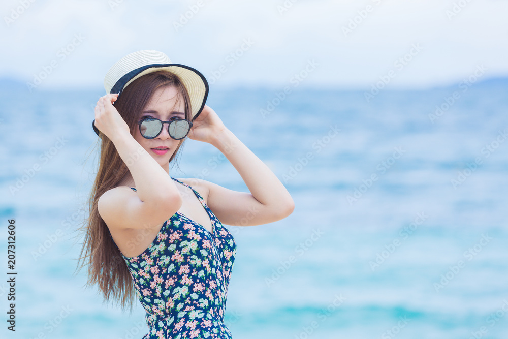 Portrait of young asian woman on the beach, Outdoor street fashion style woman, posing with trendy s