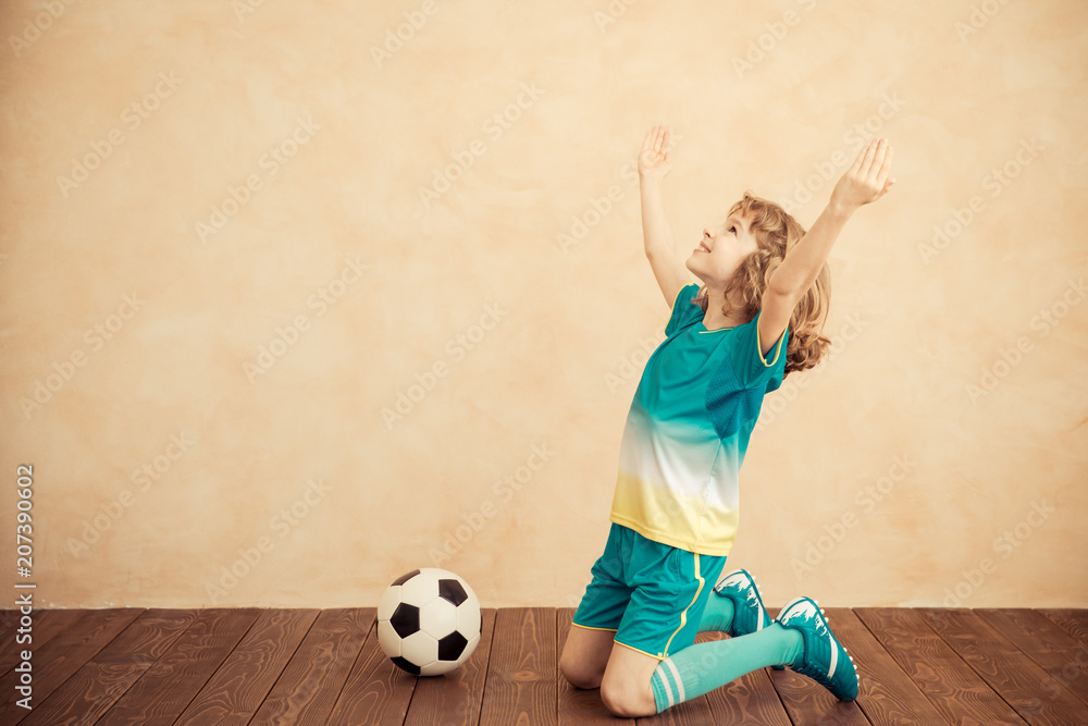 Child is pretending to be a soccer player