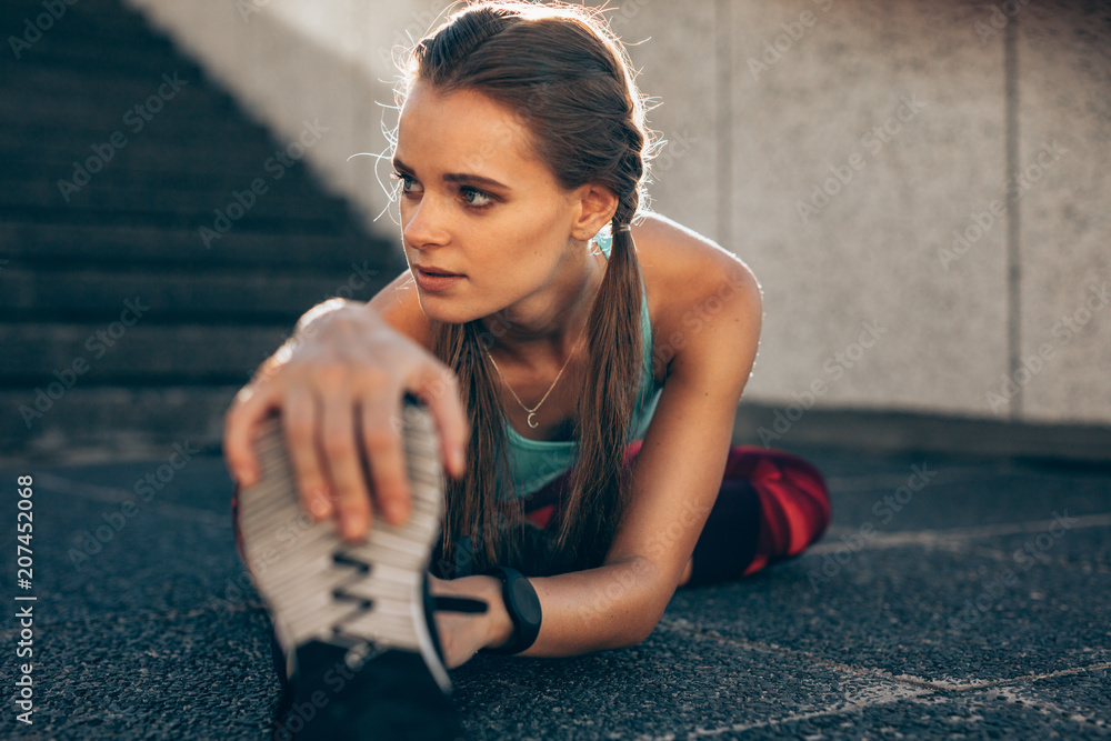 Woman doing stretching workout in morning