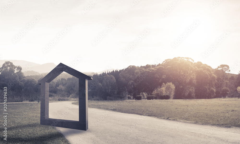 Conceptual background image of concrete home sign on asphalt roa