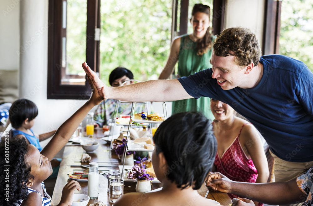 A high five between adult and child