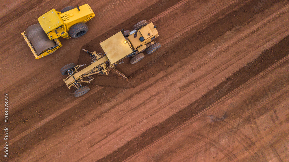 Aerial top view Tractor and Earthmoving at work.