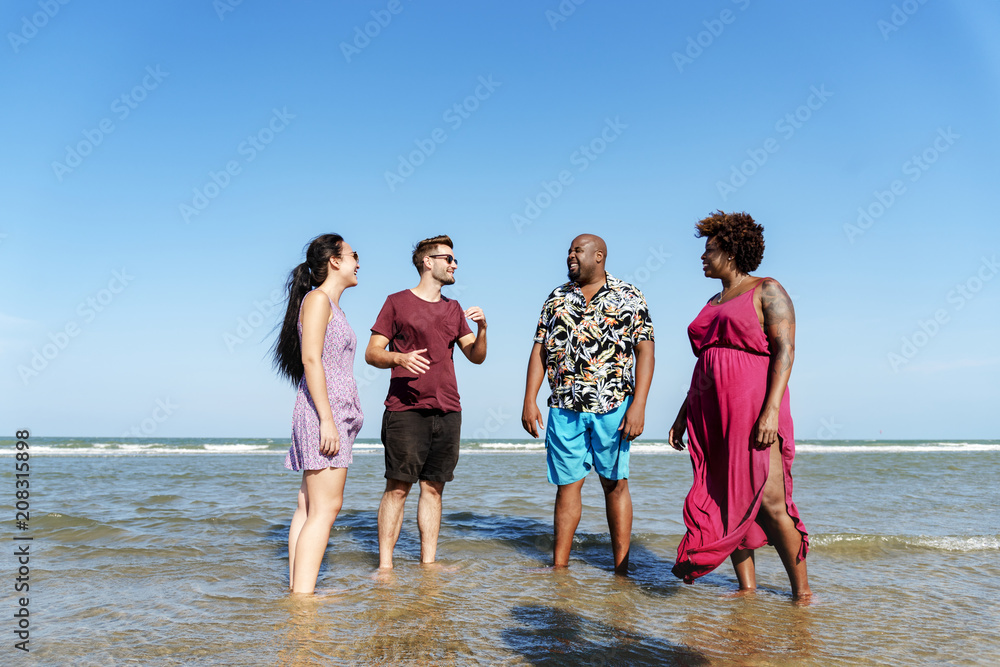 Diverse friends having fun at the beach