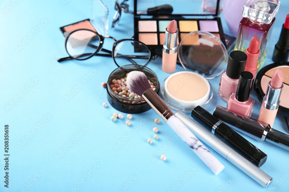 Professional cosmetics on color background