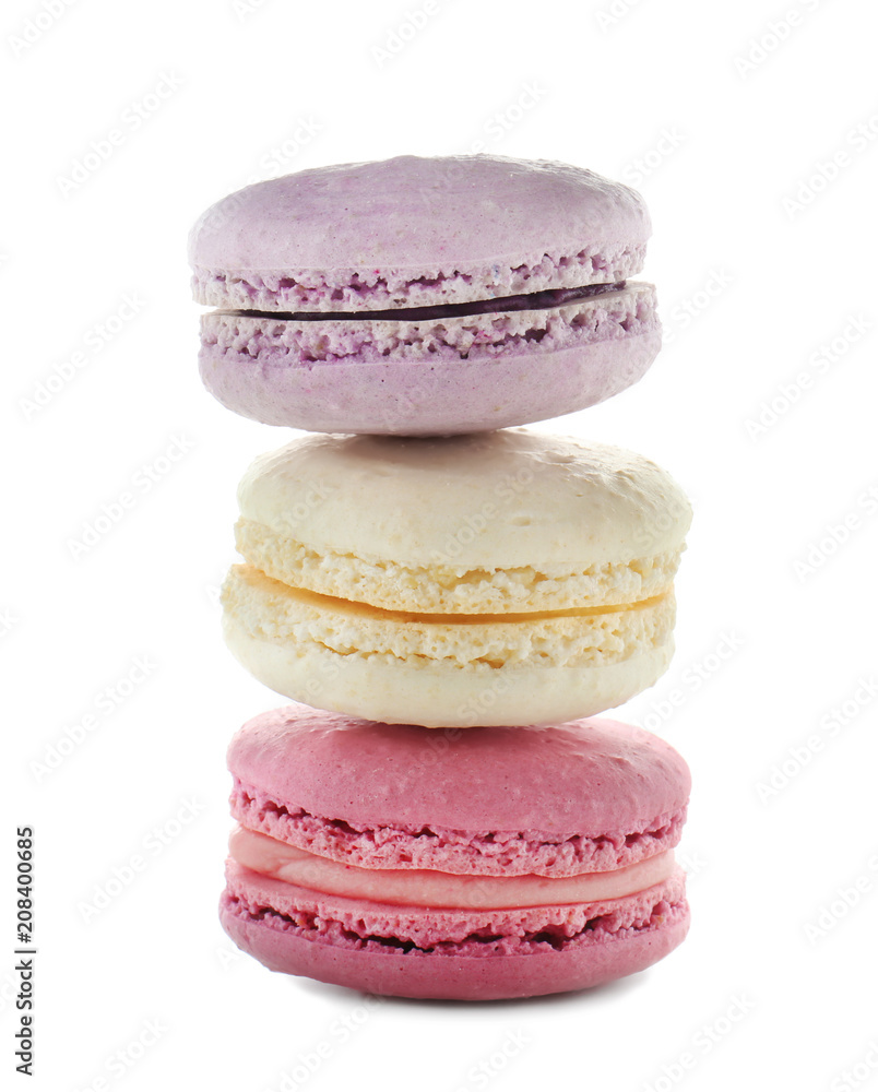 Tasty colorful macarons on white background