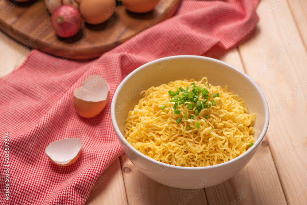 instant noodles in bowl with vegetable.