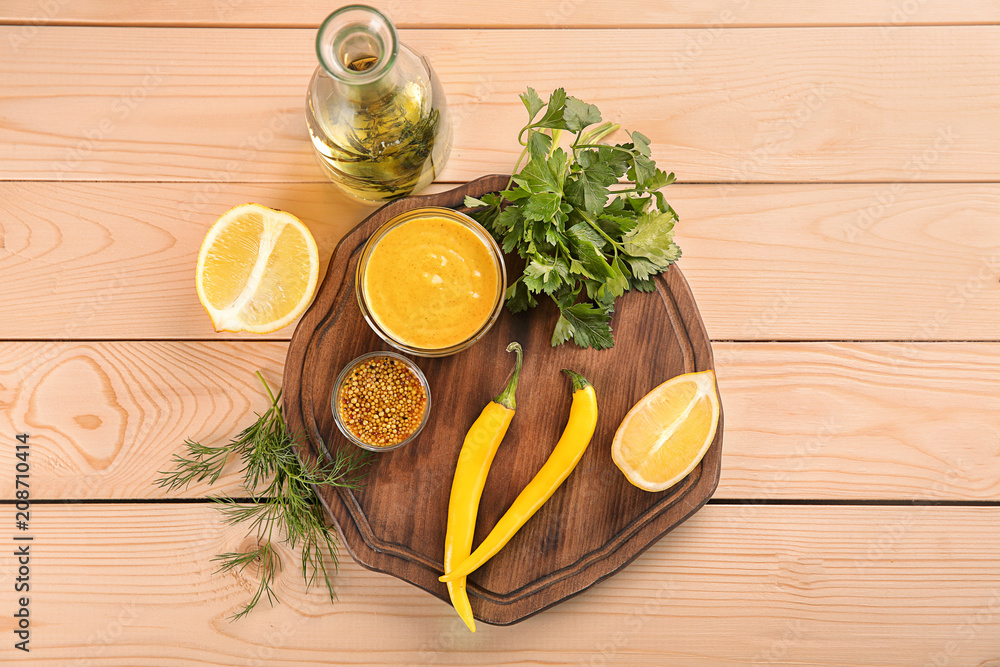 Composition with different sauces on wooden background, top view