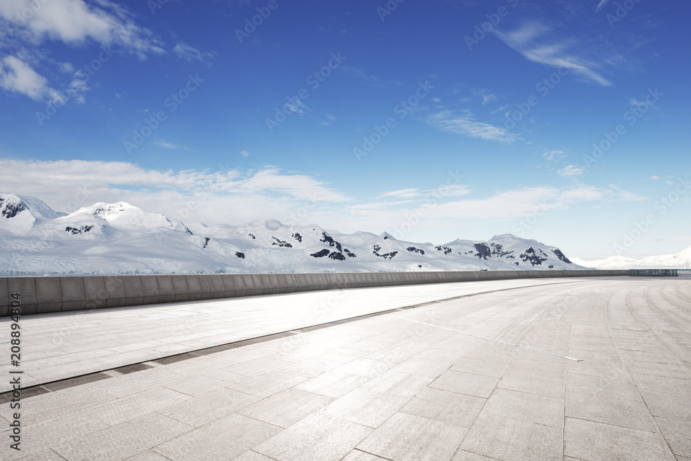 empty brick ground with sonw mountain as background