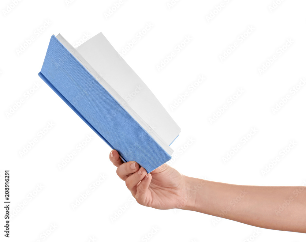 Female hand holding book on white background