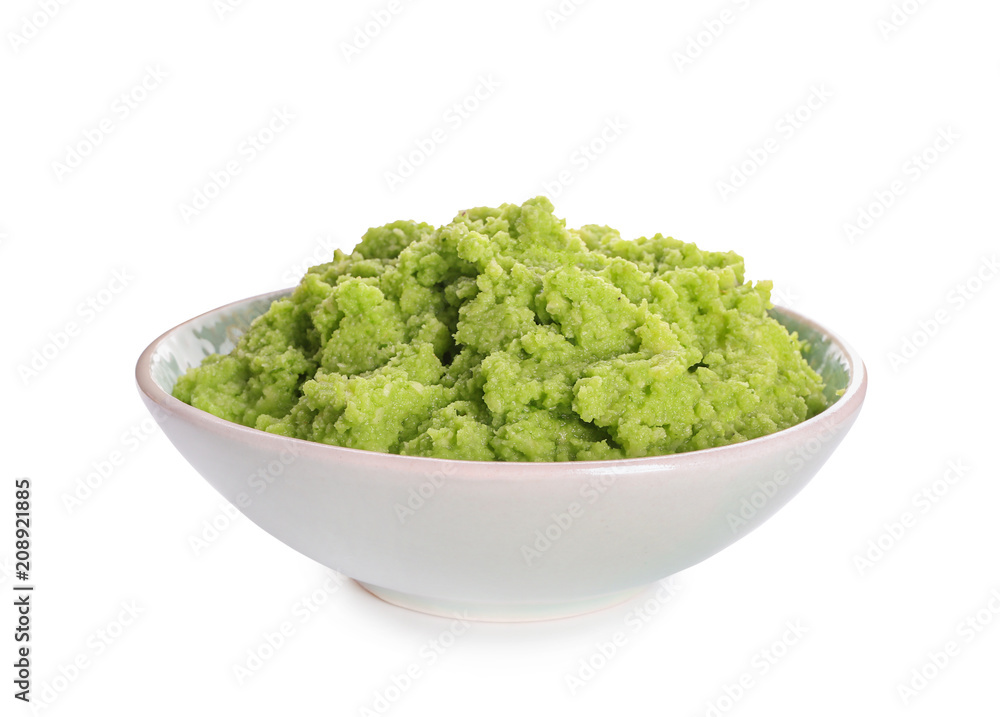 Bowl with delicious guacamole on white background