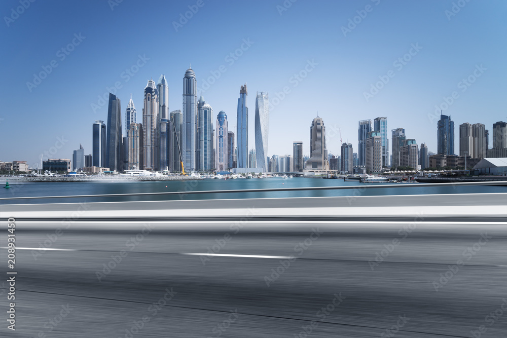 empty asphalt road with modern city skyline